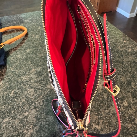 Dooney & Bourne Steamboat Willie Sling Bag - Picture 6 of 7